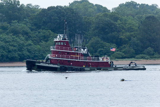 PERTH AMBOY, NEW JERSEY - August 7, 2017: The Brendan Turecamo Tugboat travels the Arthur Kill between New Jersey and Staten Island.