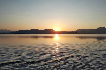 Sunset in the twilight period in the midst of nature that is reflected in the water.
