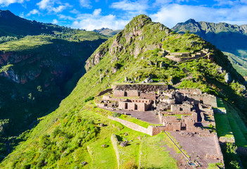 Old inca Pisac town ruins in Peru on the green hill
