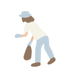 Cheerful young woman holding black trash bag