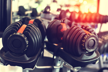 Fototapeta premium Close up dumbells set for a exercise in the fitness gym.