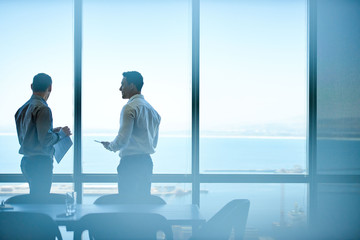 Executives discussing business from high up in an office tower