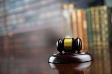 Law and justice theme, judge's gavel on court library background