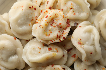Dumplings with spices texture background, close up