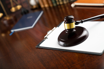 Law and justice theme, judge's gavel on court library background