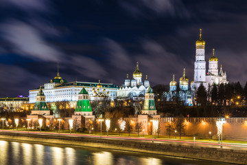 Fototapeta na wymiar Illuminated Moscow Kremlin with Grand Kremlin Palace the government residence of president of Russia. View from the embankment of Moskva river. Evening urban landscape in the blue hour