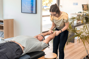 Man having chiropractic back adjustment. Physioterapy, osteopathy, alternative medicine pain relief rehabilitation