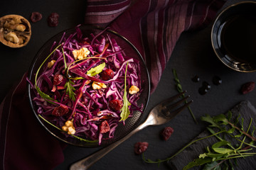 Red cabbage salad with nuts and arugola