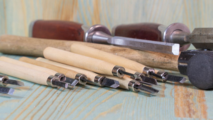 wooden chisels. lying on a wooden table