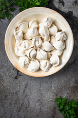 tortellini with filling (ravioli dumplings) menu concept. food background. top view. copy space