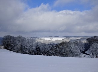Obraz premium winter landscape, forest and valley and beautiful sky