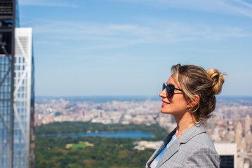 a woman against the backdrop of the city