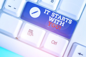 Conceptual hand writing showing It Starts With You. Concept meaning Motivation for starting doing...
