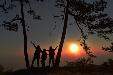 silhouette of man and woman at sunset