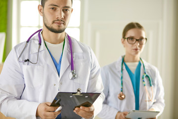 Fototapeta premium Portrait of group of smiling hospital colleagues standing together