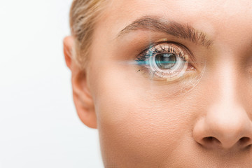 Obraz premium cropped view of young woman looking at camera with digital illustration on eye isolated on white