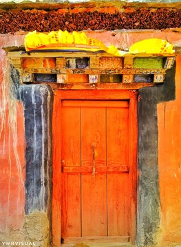 a red colored traditional buddhist monastery door