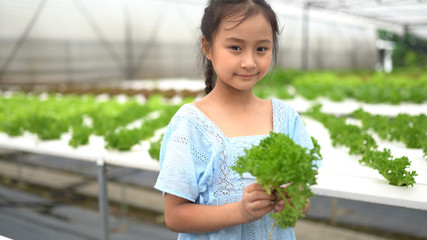Cute asian girl having fun at hydro farm