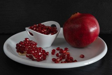 pomegranate on a white plate.
