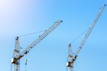 Construction site, silhouettes of the construction industry. Construction, construction cranes