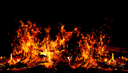 a huge bonfire at night