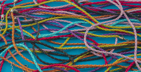Colorful braided laces on a blue background