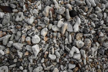 Close up of rounded and polished beach rocks. Pebble stones at the sea, Colorful Pebble Stones.