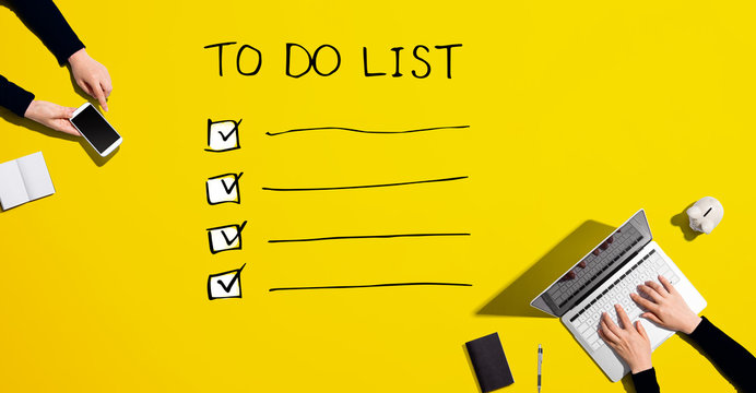To do list with people working together with laptop and phone