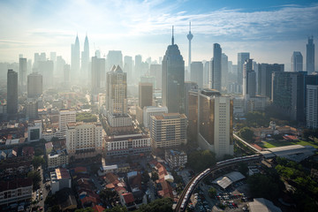 Fototapeta na wymiar Cityscape of Kuala lumpur city skyline on blue sky with sunlight in Malaysia at daytime.