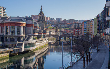 Old town of Bilbao with the San Anton bridge and the riverside market next to the estuary