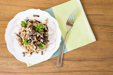Porridge of oats and spelt with mushrooms. Useful porridge with mushrooms. Vegetarian dish of cereals and mushrooms. Porridge with mushrooms. Copy space.