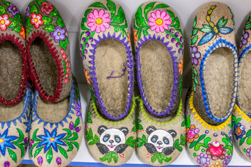 Russian national shoes. Sale of Russian Souvenirs in the boutique. Russian warm Slippers. Selling shoes in the store.