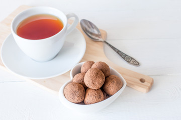 Homemade energy sweet balls-sweets with dried apricots, raisins, dates, prunes, walnuts, cashews and coconut. Indian vegetarian desserts. Healthy sweet food for tea drinking.