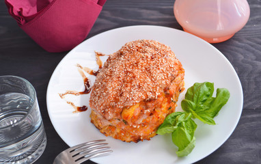 Thanksgiving, holiday, dinner. Cupcake casserole with chicken, carrots, onions and cheese on a wooden table. Food concept on a festive table.