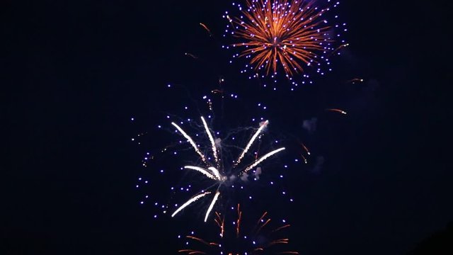  fireworks explode in dark sky on July 4 Independence Day