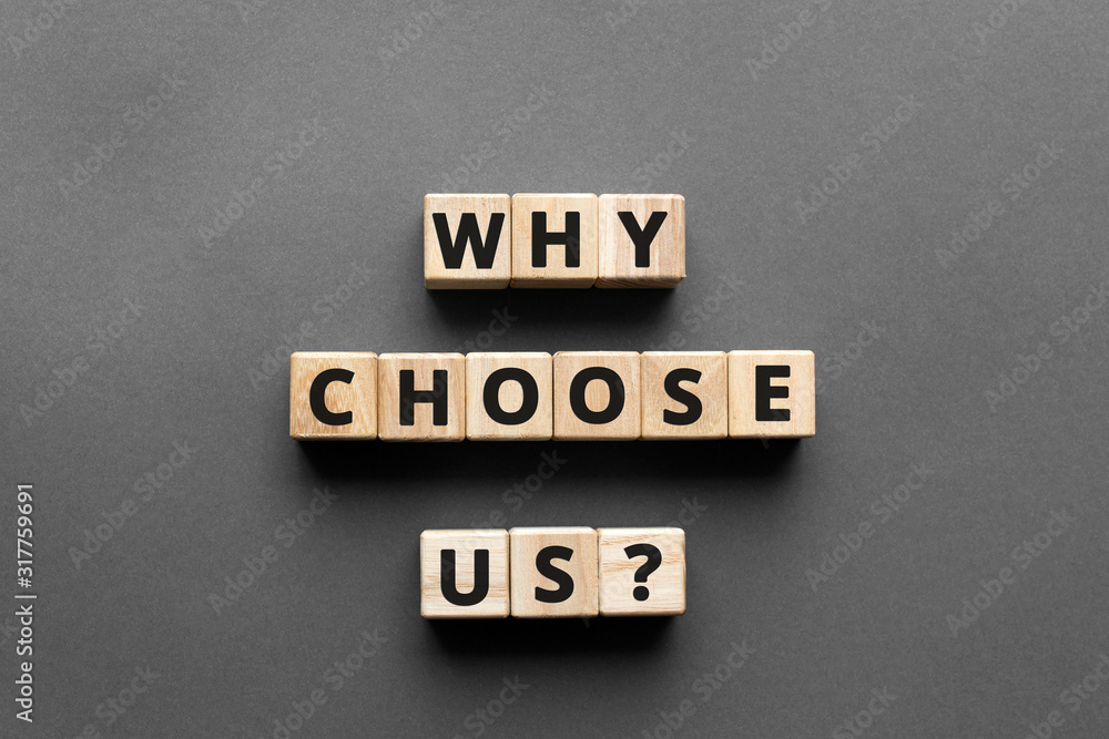 Poster why choose us? - words from wooden blocks with letters, top view gray background