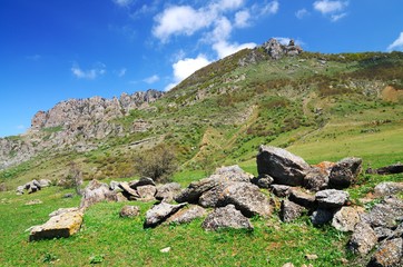 Fototapeta na wymiar Huge stone in a mountain valley