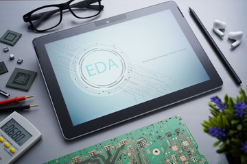 Industrial 4.0 concept on EDA Electronic Design Automation with a simple Illustrative of circuit board written on tablet PC with electronic instrument
