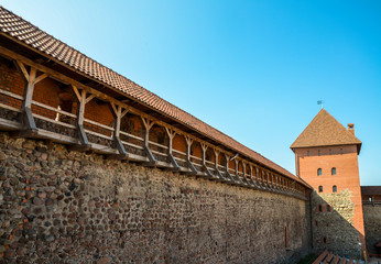 Walls and a tower of an ancient medieval castle in the city of Lida, Belarus 