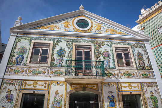 Beautiful tile-covered facade of the Vi&uacute;va Lamego tile factory at Largo do Intendente square. Lisbon, Portugal.