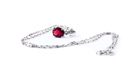 Necklace with the ruby stones on the white