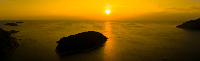 aerial view sunset above Nai Harn beach. Nai Harn beach is a famouse landmark and popular sunset viewpoint of Phuket Thailand