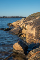 Winter sun at rocks in Sillvik in Gothenburg in Sweden