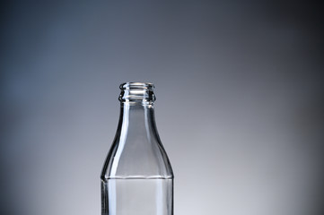 Empty glass bottle for reusable drinks.