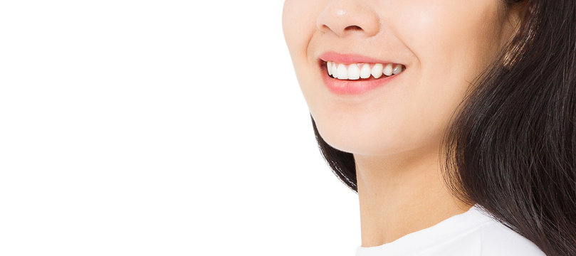 Closeup banner smiling asian woman mouth and white healthy teeth with whitening treatment isolated on white background. Dental women tooth care. Beautiful healthy smile close-up.