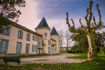 Ancient castle chateau de Thouars in South West of France viewed from the public street in winter. Vintage colors Style.
