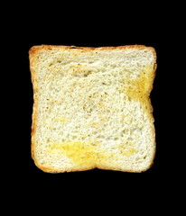 toasted slice of white bread isolated on a black background, breakfast food menu