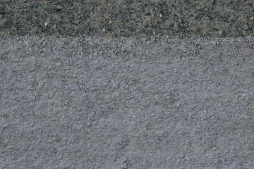 Grey concrete walls of residential buildings.