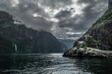 Fiord with cloudy sky during rainy day