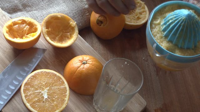 Making orange juice in a traditional way in a home.Concept: healthy and homemade food